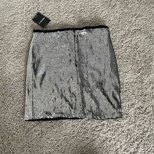 Silver sequin miniskirt with black velvet detail at top